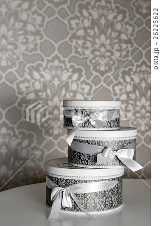 Three round celebration gift boxes with silver 26225622