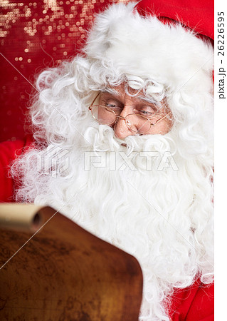 Portrait of happy Santa Claus holding Christmas 26226595