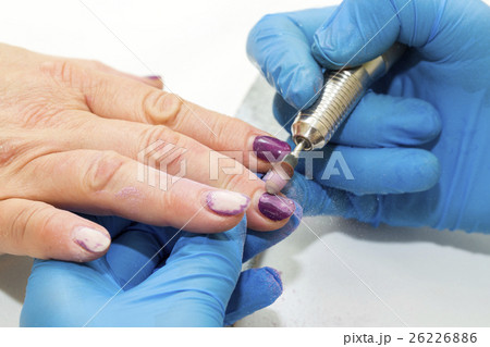 Woman doing manicure beauty salon varnish wellness Woman doing manicure beauty salon varnish wellness 26226886