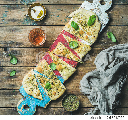 Focaccia with basil leaves, olive oil, wine on 26228762