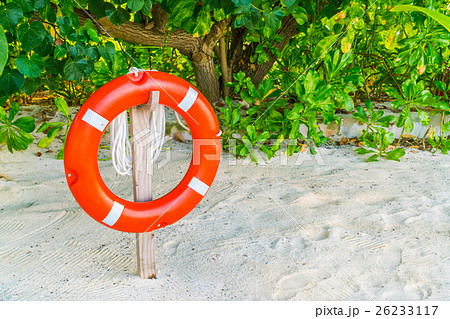 lifebouy or safety ring in maldives resort at the sunrise time . 26233117
