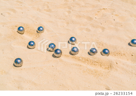 Bocce balls on white sandy beach . 26233154