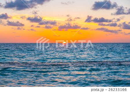 Beautiful sunset with sky over calm sea in tropical Maldives island 26233166