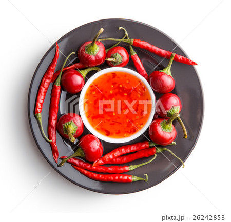Red chili peppers and chili sauce. 26242853