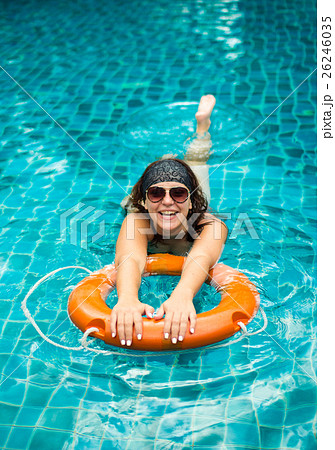 girl in the pool on a buoy 26246035