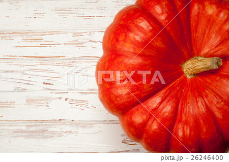 Large pumpkin on white wood 26246400