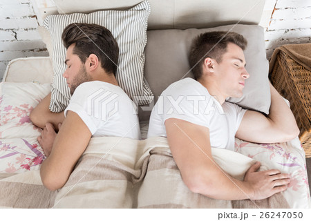 Sweet gay couple sleeping together 26247050