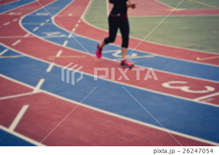 Female runner on running track Female runner on running track 26247054