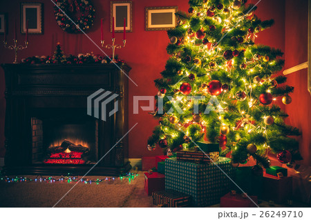 Christmas living room with Christmas tree and gift Christmas living room with Christmas tree and gift 26249710