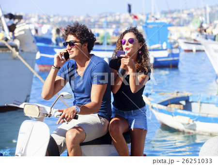 Young Italian Couple on Vespa Scooter 26251033