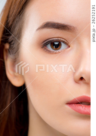 The face of woman on gray background 26252191