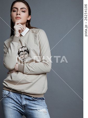 Beautiful fashion model wearing grey jumper scull 26254106