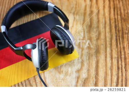 course language headphone and flag on a table 26259821