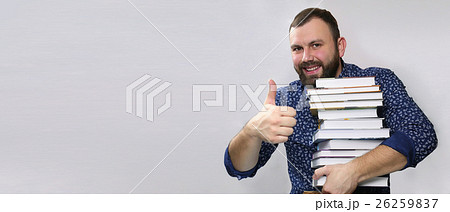 student adult beard man with stack of book student adult beard man with stack of book 26259837