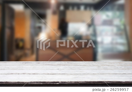 Wood table top on blur background of coffee shop Wood table top on blur background of coffee shop 26259957