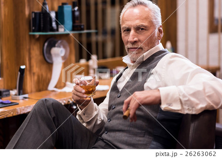 Man sitting with cognac glass and cigar 26263062