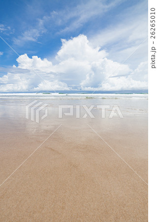 Waves sand beach and clouds sunny day 26265010