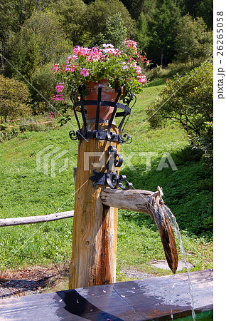 Wooden Fountain with Flowers Engadine Switzerland Wooden Fountain with Flowers Engadine Switzerland 26265058