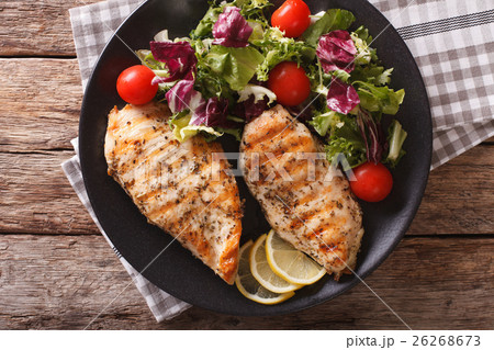 Grilled chicken breast with salad Grilled chicken breast with salad 26268673