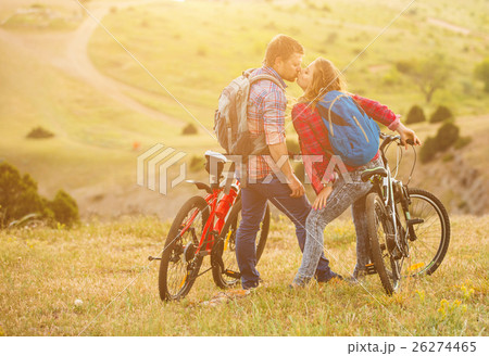 young couple riding bikes in the mountains young couple riding bikes in the mountains 26274465