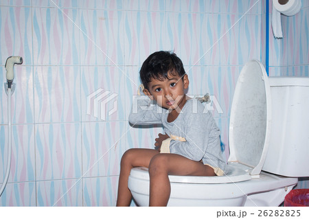 Child asian little boy defecate in toilet 26282825