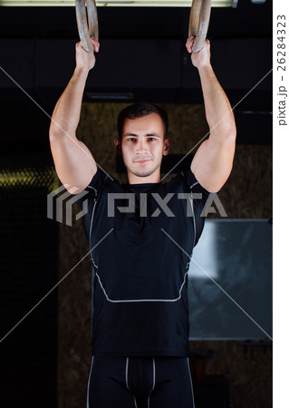 man using gymnastic rings 26284323