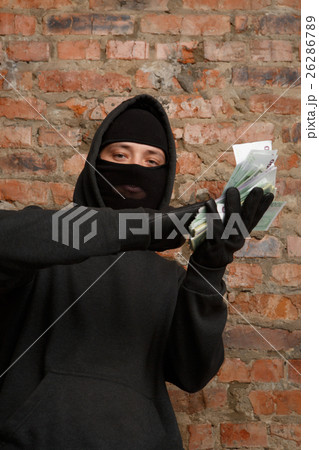 Burglar with packet of money Burglar with packet of money 26286789
