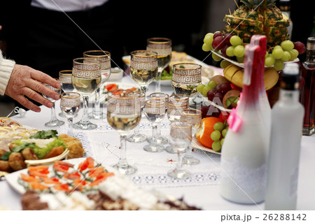 The buffet table with snacks and alcohol  26288142