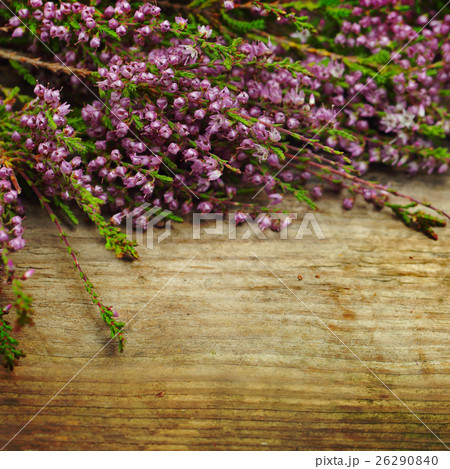 Flowers on the old wooden background 26290840