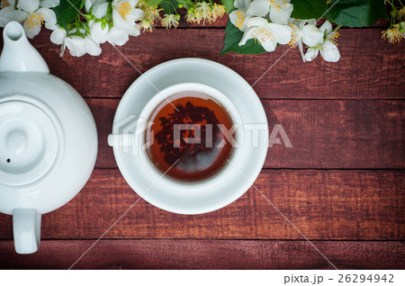 cup of black tea with,teapot and jasmine branches cup of black tea with,teapot and jasmine branches 26294942