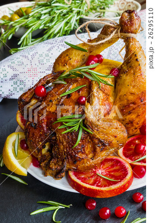 Roasted whole chicken on white plate on stone 26295110