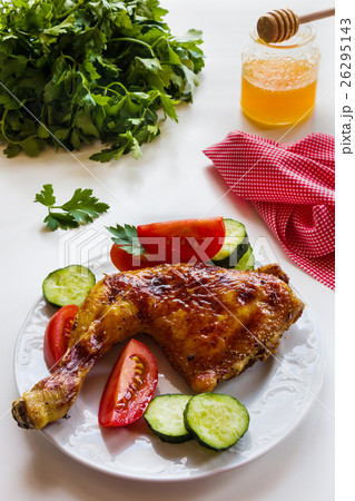 Roasted chicken legs cooked with sauce from orange 26295143