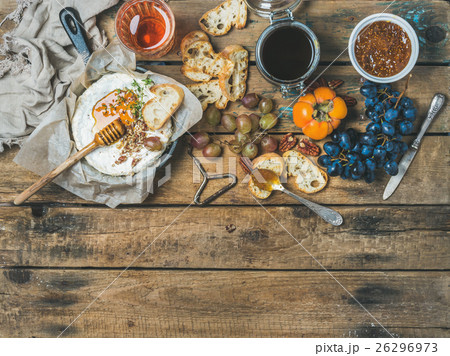 Camembert cheese, fruits, bread, honey, nuts, jam 26296973