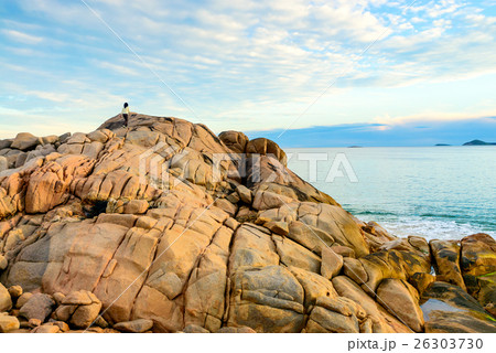 Woman climbing the rock 26303730