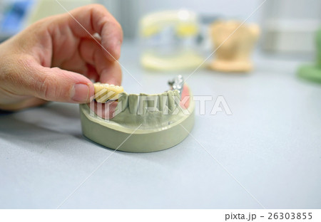 Dental technician working in  laboratory 26303855