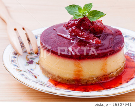 Strawberry cheesecake with fresh mint leaves  26307941