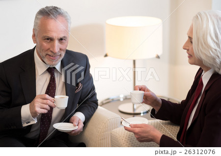 Delighted businessman having a break with his 26312076