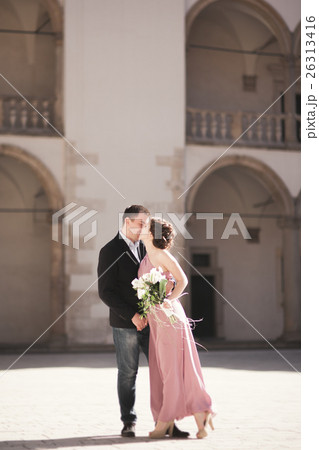Beautiful couple, man, girl with long pink dress Beautiful couple, man, girl with long pink dress 26313416