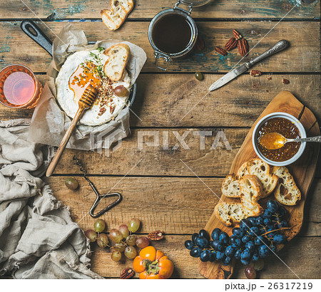 Cheese, fruit, nut and wine set over rustic wooden 26317219