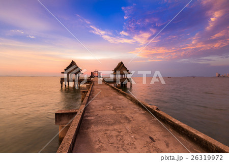 Sunset sky with walking way leading to ocean 26319972