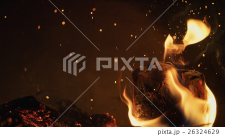 close up wood burning in the fireplace 26324629