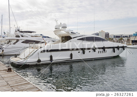 Modern yacht moored on the pier 26327261