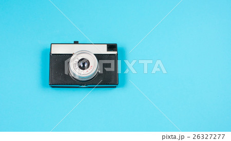 vintage film camera on blue background vintage film camera on blue background 26327277