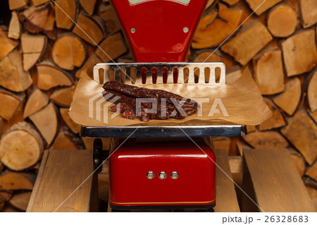 Sausage on red scales 26328683