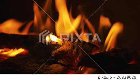 close up photo of flames in a fireplace 26329029