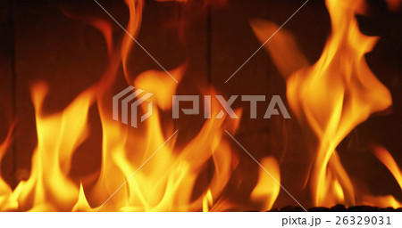 close up photo of flames in a fireplace 26329031