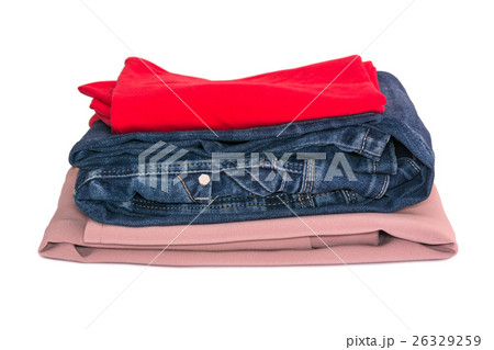 Stack of clothes isolated on white background. Jeans, red and beige blouse. Stack of clothes isolated on white background. Jeans, red and beige blouse. 26329259