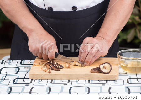 Chef is cutting mushroom Chef is cutting mushroom 26330761