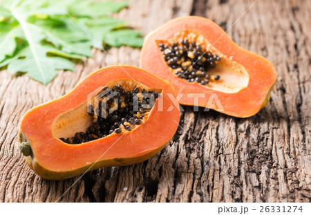 sliced papaya fresh fruit on wood background 26331274