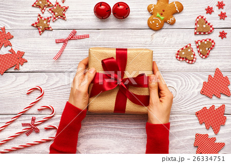 Woman holding christmas present 26334751